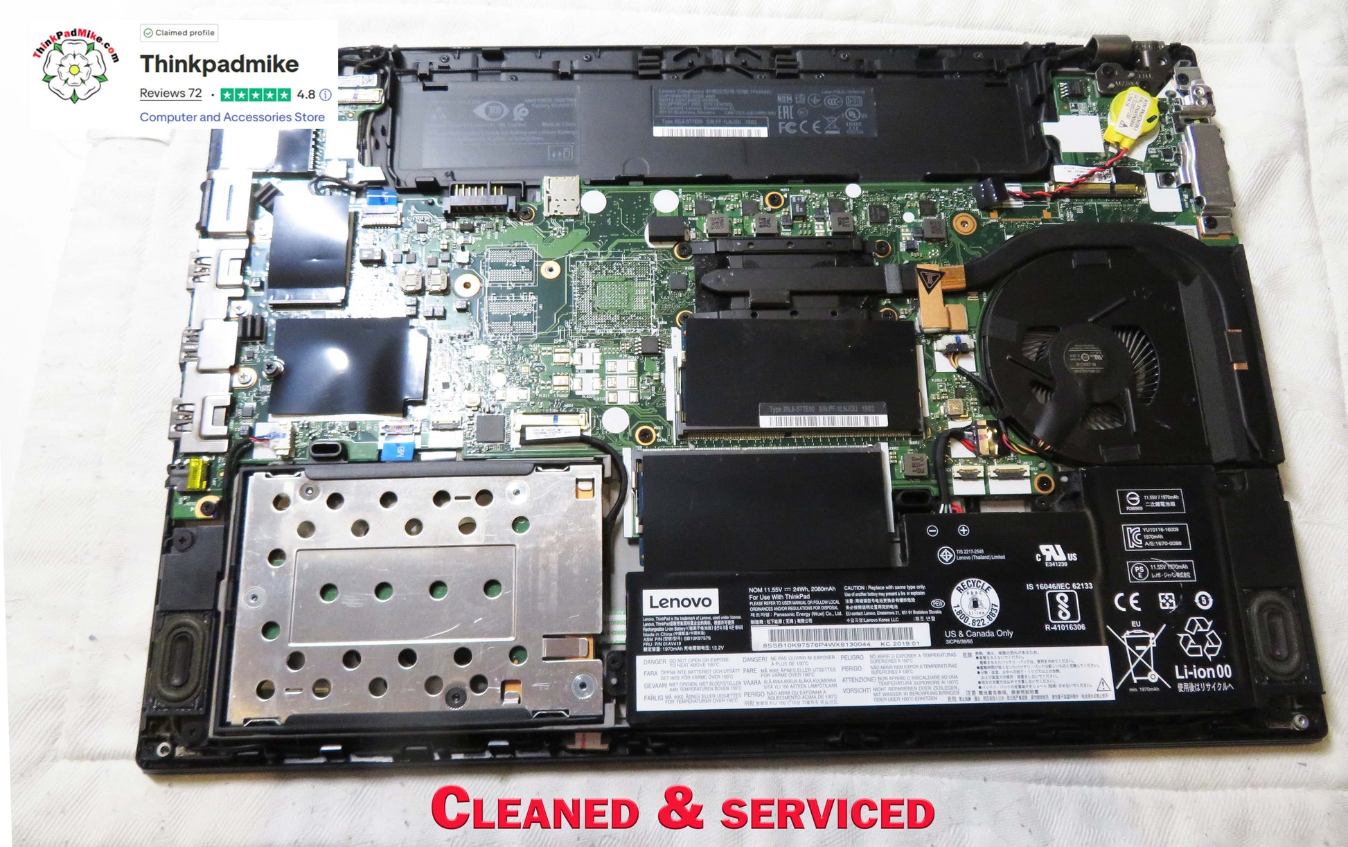 Laptop with its top cover removed, exposing the internal components, on a white background.